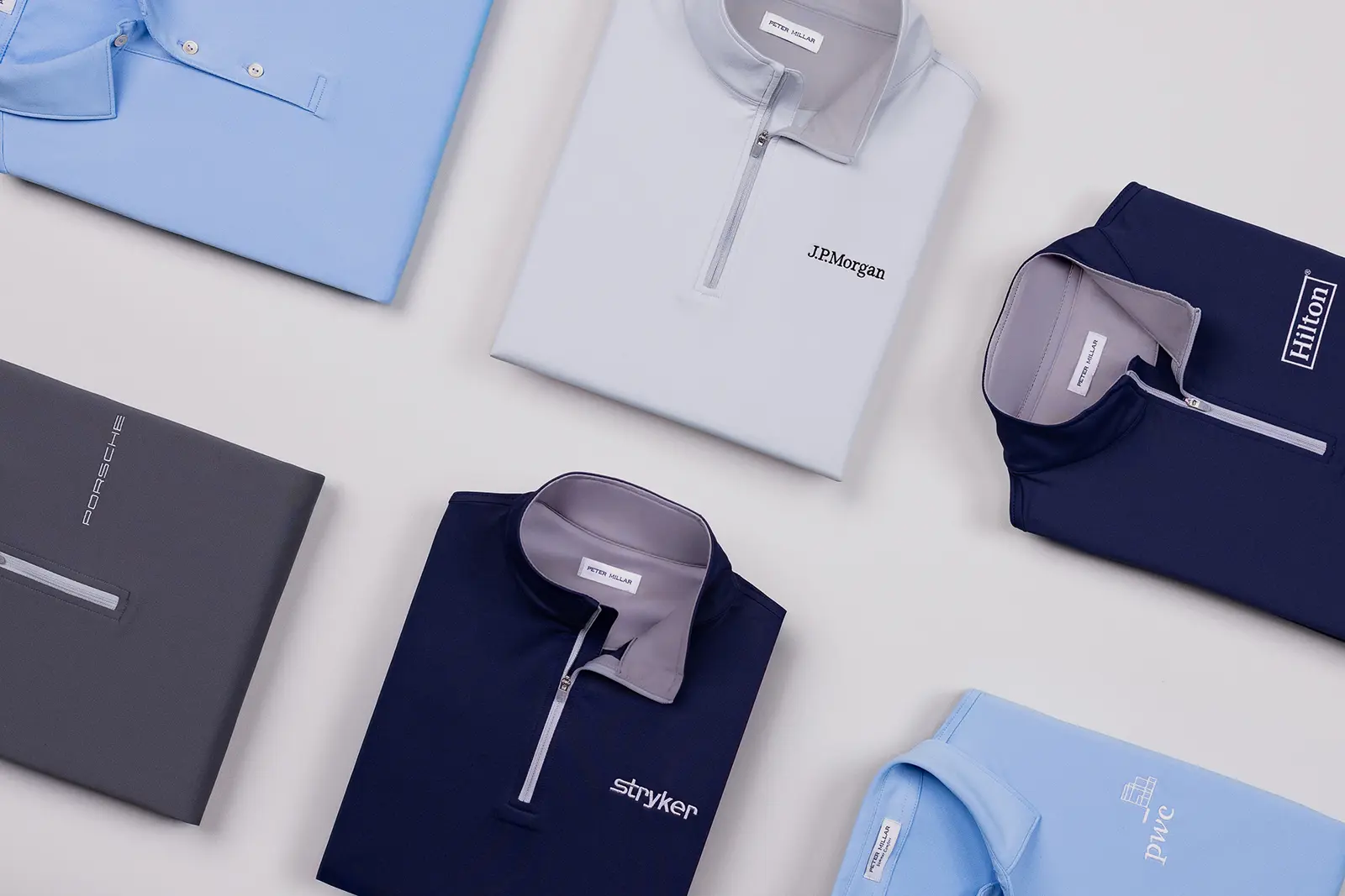 Custom Peter Millar zip-up layers for a polished corporate look by ParsonsKellogg.